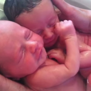 Newborn twins won’t stop cuddling like they did in the womb