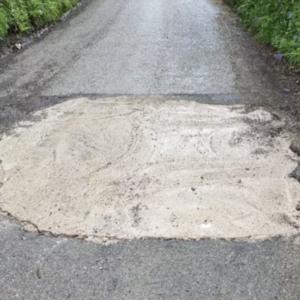 Motorist Takes Matters Into Their Own Hands to Fix Pothole