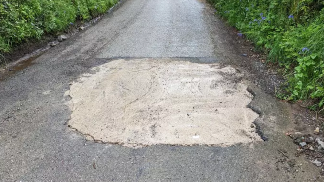 Motorist Takes Matters Into Their Own Hands to Fix Pothole