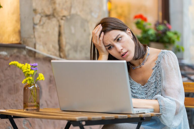 Surprised Young Woman Use Laptop Loses, Bad News, Fortune Loss, Fail Outdoors In City Cafe Terrace