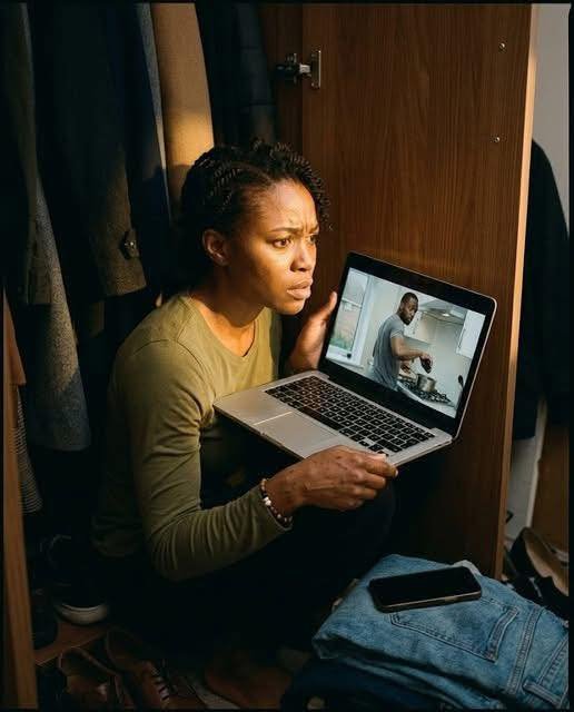 "A woman sitting in a dark closet, her face illuminated by the glow of a laptop screen showing grainy footage, her expression a mix of shock, anger, and determination as she watches her husband tamper with her food."