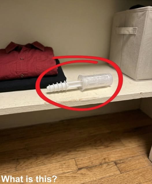 "A man sitting on the edge of a bed, holding a small, unfamiliar object from a wardrobe, his expression a mix of suspicion and realization as he confronts his own fears."