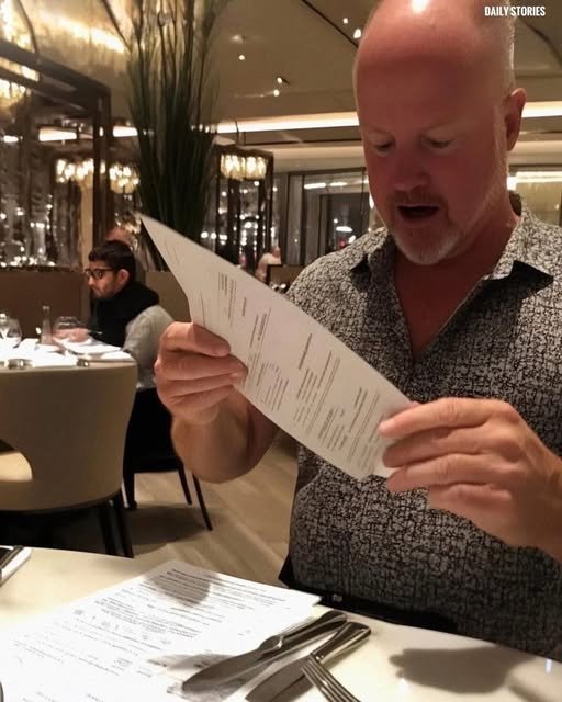 A young woman sits at a fancy restaurant table, her expression a mix of shock and hurt as her parents hand her the bill while the rest of the family looks on, oblivious.