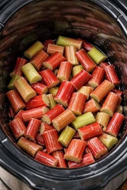 Slow cooker rhubarb dessert with a soft jam-like texture served warm in a bowl