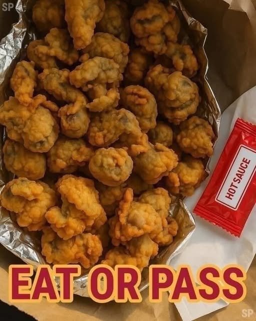 Golden crispy Southern-style fried chicken gizzards served on a plate with dipping sauce.
