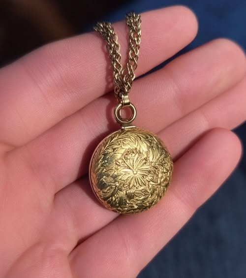 An elderly woman holds a delicate pendant, her expression a mix of joy and nostalgia, as she stands in a flea market, symbolizing the moment her past found its way back to her.